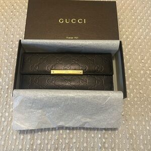 Authentic Gucci Black Leather Wallet with Gold Detail